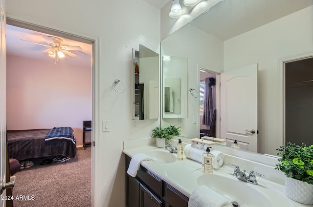 bathroom with ceiling fan and vanity