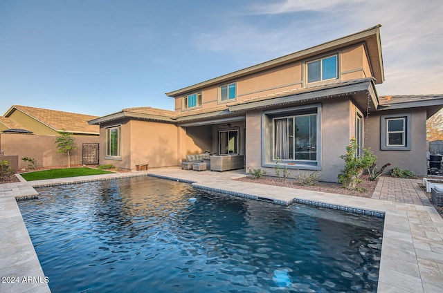 back of house with a patio