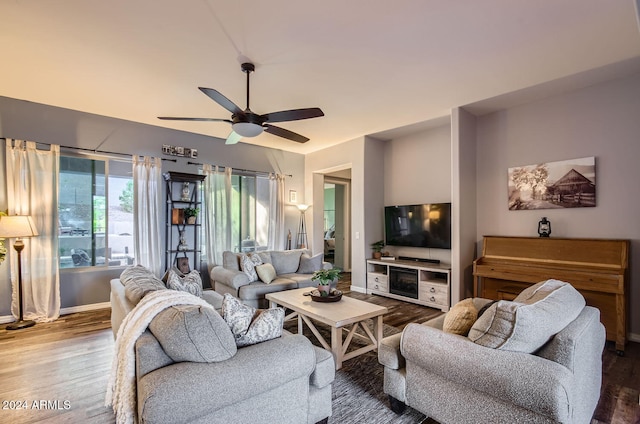 living room featuring hardwood / wood-style flooring and ceiling fan