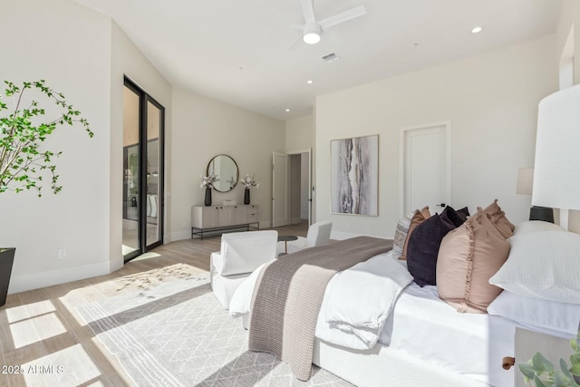 bedroom with baseboards, light wood-style flooring, visible vents, and recessed lighting