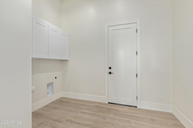 washroom with light wood finished floors, cabinet space, baseboards, hookup for a gas dryer, and hookup for an electric dryer