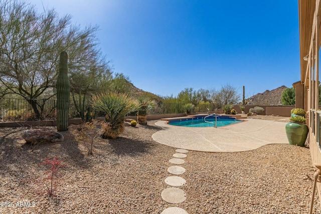 view of swimming pool featuring a patio area, a fenced backyard, and a fenced in pool