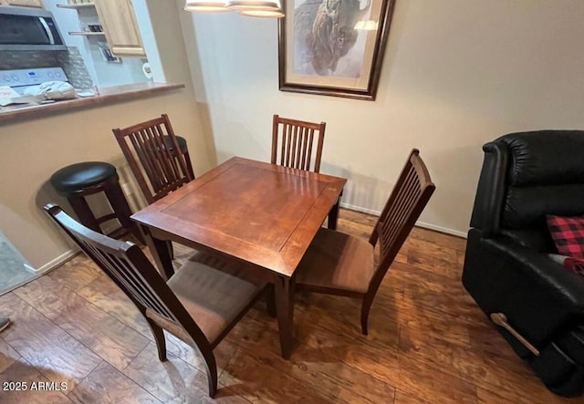 2361 Quarter Horse Trl Unit 232, Overgaard, AZ 85933 - dining space with baseboards and wood finished floors