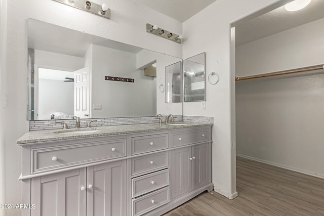 bathroom with vanity and hardwood / wood-style floors