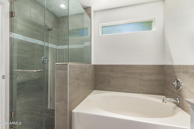 bathroom with independent shower and bath