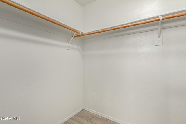 walk in closet featuring light wood-type flooring