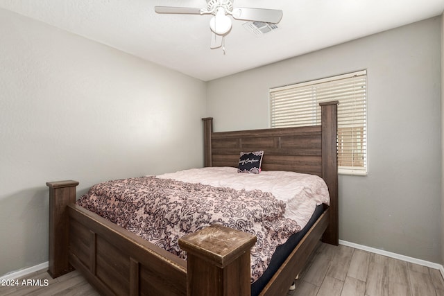 bedroom featuring light hardwood / wood-style floors and ceiling fan