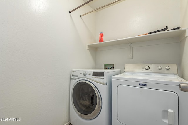 washroom with washer and clothes dryer