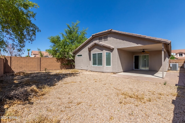 rear view of property featuring ceiling fan, a patio, and central air condition unit