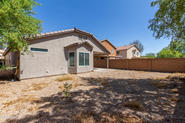 back of property featuring a patio