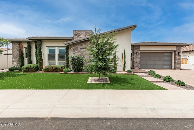 13850 W Weaver Ct, Litchfield Park, AZ 85340 - view of front facade featuring driveway, an attached garage, stone siding, and stucco siding