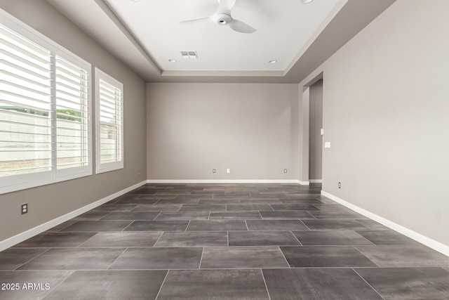 13850 W Weaver Ct, Litchfield Park, AZ 85340 - empty room featuring ceiling fan, a raised ceiling, baseboards, and recessed lighting