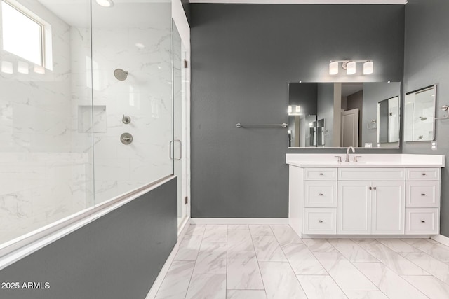 13850 W Weaver Ct, Litchfield Park, AZ 85340 - bathroom featuring marble finish flooring, a marble finish shower, vanity, and baseboards