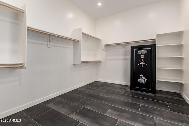 13850 W Weaver Ct, Litchfield Park, AZ 85340 - walk in closet with dark tile patterned flooring