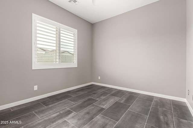 13850 W Weaver Ct, Litchfield Park, AZ 85340 - spare room featuring baseboards