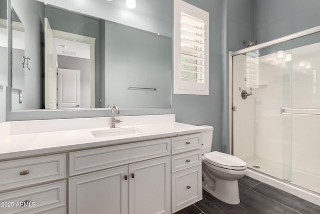 13850 W Weaver Ct, Litchfield Park, AZ 85340 - full bath with a shower stall, vanity, and toilet
