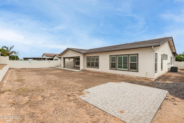 13850 W Weaver Ct, Litchfield Park, AZ 85340 - rear view of property with a patio, a fenced backyard, stucco siding, and central AC unit