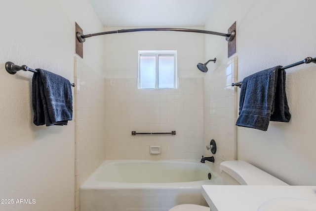 full bathroom featuring toilet, vanity, and shower / washtub combination