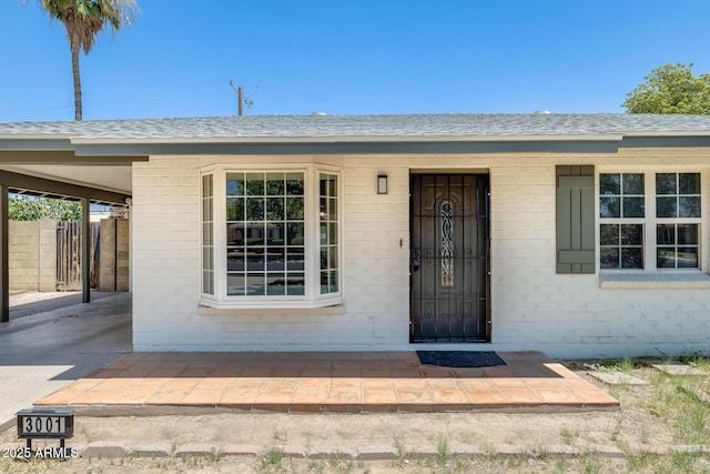 3001 N 21st Ave, Phoenix, AZ 85015 - property entrance featuring roof with shingles and an attached carport