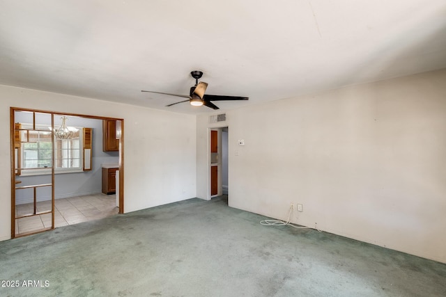 3001 N 21st Ave, Phoenix, AZ 85015 - spare room with light colored carpet, a chandelier, and ceiling fan
