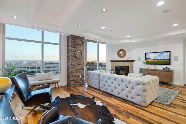 living room with hardwood / wood-style flooring and a healthy amount of sunlight