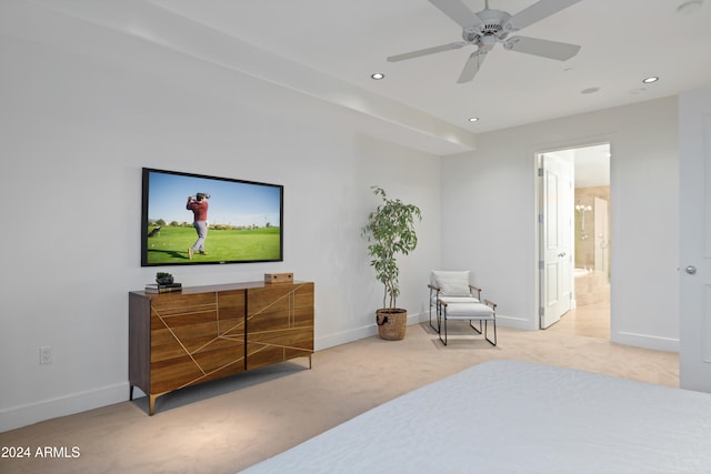 carpeted bedroom with connected bathroom and ceiling fan