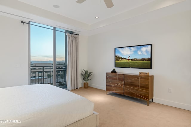 carpeted bedroom featuring ceiling fan and access to exterior