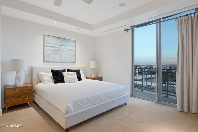 carpeted bedroom featuring ceiling fan and access to exterior