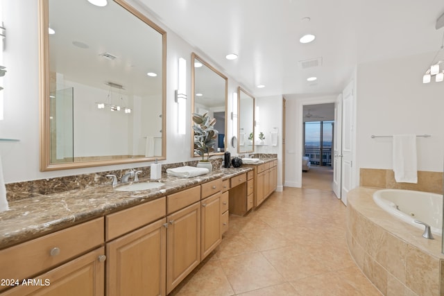 bathroom featuring separate shower and tub, tile patterned flooring, and vanity