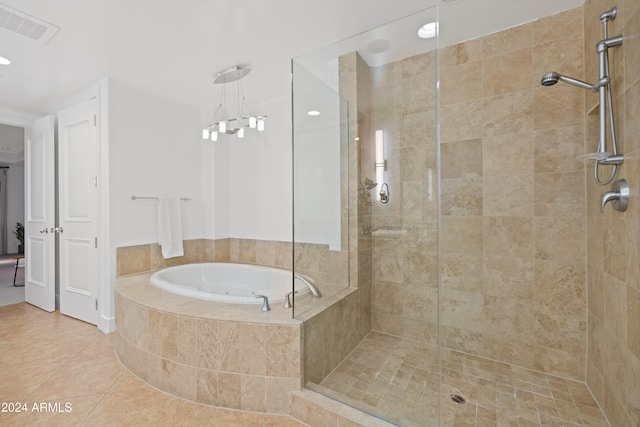 bathroom featuring tile patterned flooring and plus walk in shower