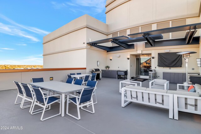 view of patio featuring outdoor lounge area and a grill