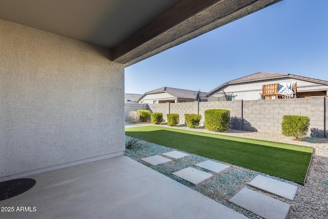 view of yard with a patio area and fence