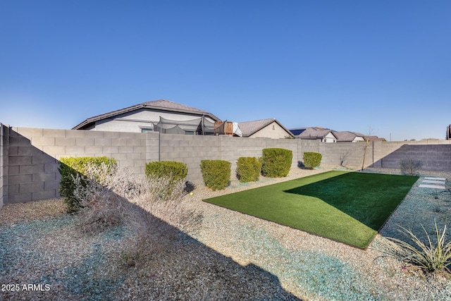 view of yard featuring a fenced backyard