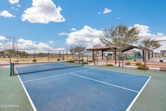 view of tennis court with fence