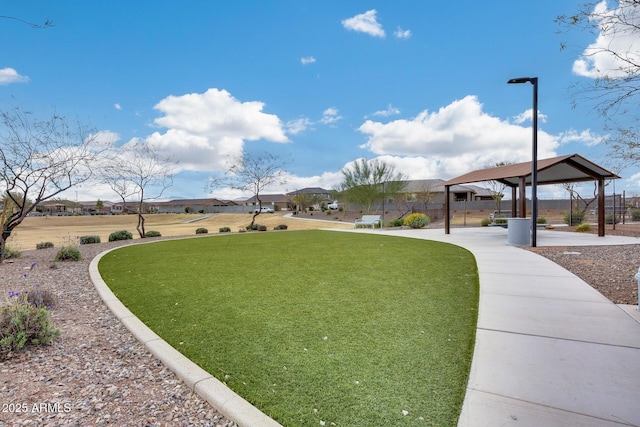 view of community featuring a lawn and a gazebo