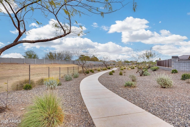 view of community featuring fence