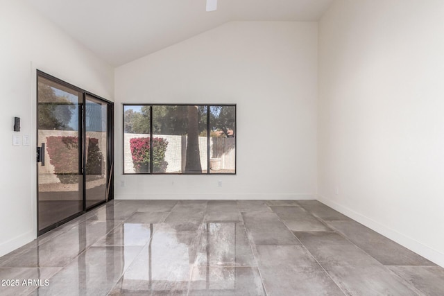 spare room featuring vaulted ceiling