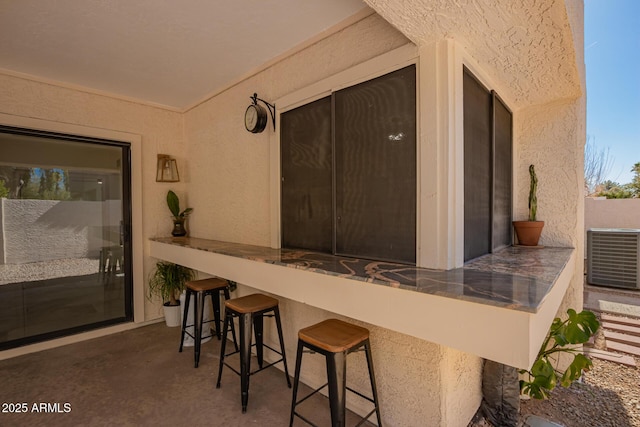 view of patio featuring an outdoor bar