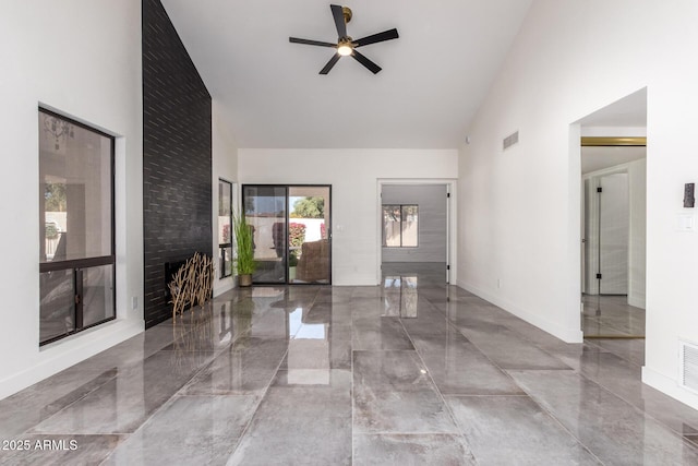 entryway with high vaulted ceiling and ceiling fan