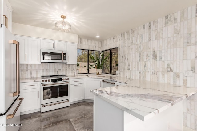 kitchen featuring high end fridge, light stone countertops, white cabinets, pendant lighting, and electric range