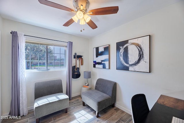 office area with ceiling fan, wood finished floors, and baseboards