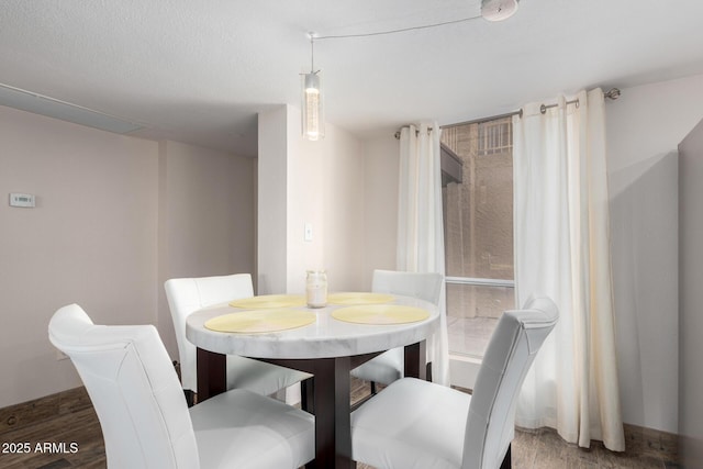 dining room with wood-type flooring