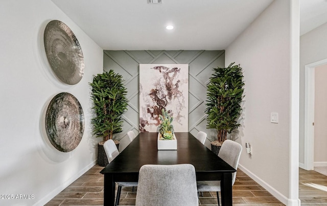 dining area with recessed lighting, baseboards, and wood tiled floor