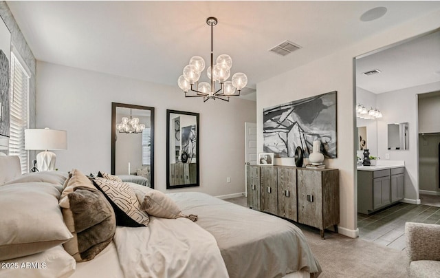 bedroom featuring baseboards, visible vents, and a chandelier