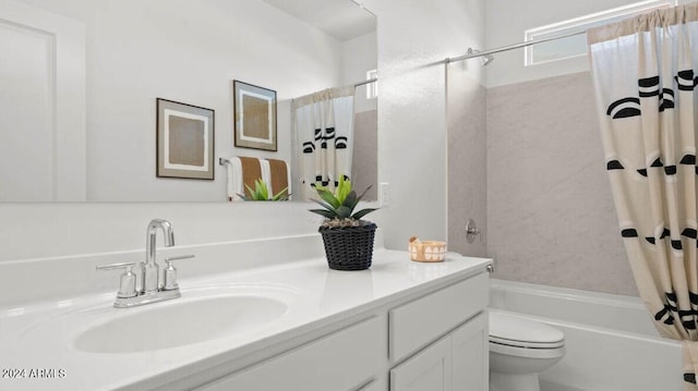 bathroom featuring vanity, shower / bathtub combination with curtain, and toilet