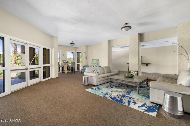 7512 N Via Camello Del Sur, Scottsdale, AZ 85258 - carpeted living room with a textured ceiling