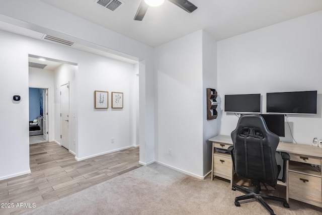 office space featuring ceiling fan and light hardwood / wood-style flooring