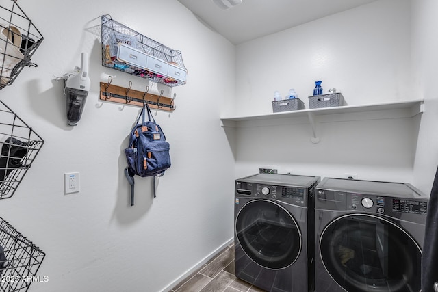 laundry area with washing machine and clothes dryer