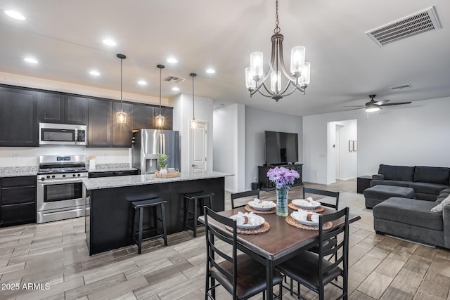 dining room featuring ceiling fan