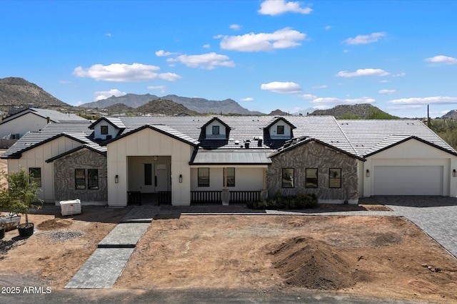 3323 N 81st St, Mesa, AZ 85207 - modern inspired farmhouse featuring a mountain view, an attached garage, a porch, stone siding, and decorative driveway